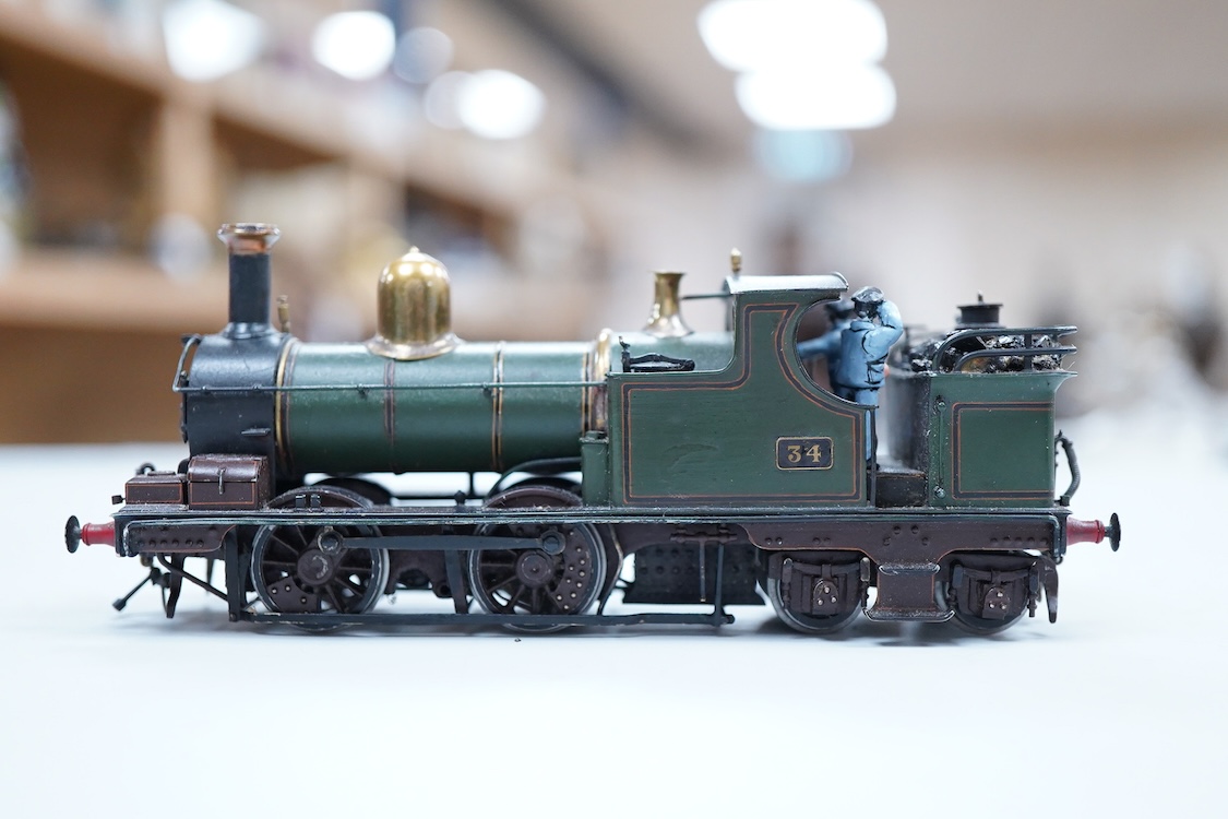 A narrow gauge scratch built model railway locomotive running on 32mm track by John Worsley, a Ruston 0-4-0 diesel shunter, 7, a detailed model with sprung buffers, etc. and fitted with a Mashima 12v dc motor, for two ra